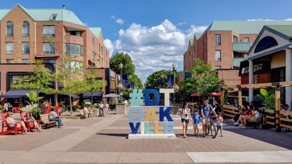 Towne Square public plaza in Downtown Oakville with people relaxing and walking
