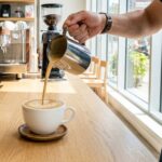 Oakville Coffee Shops: Specialty coffee being poured in a modern café in Oakville Ontario